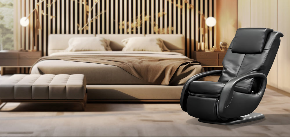 Human Touch WholeBody 7.1 Massage Chair in black placed in a bedroom setting, Wish Rock Relaxation lifestyle image showcasing comfort and design.