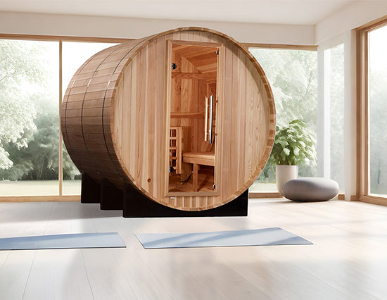 Golden Designs "Arosa" 4 Person Barrel Traditional Sauna in Pacific Cedar shown in a serene yoga room setting from Wish Rock Relaxation