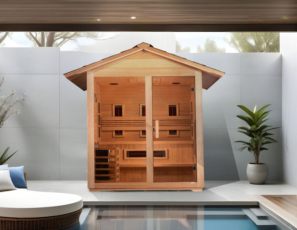 Golden Designs "Carinthia" 3 Person Hybrid Outdoor Sauna in Canadian hemlock placed beside a modern pool and lounge area from Wish Rock Relaxation