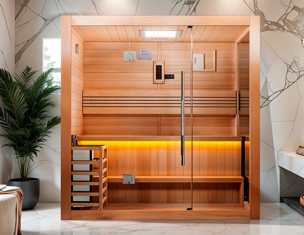 Golden Designs "Forssa Edition" 3-4 Person Indoor Traditional Sauna - Canadian Red Cedar displayed in a modern spa-inspired room, featuring natural wood construction, tempered glass door, built-in heater, and warm ambient lighting from Wish Rock Relaxation.