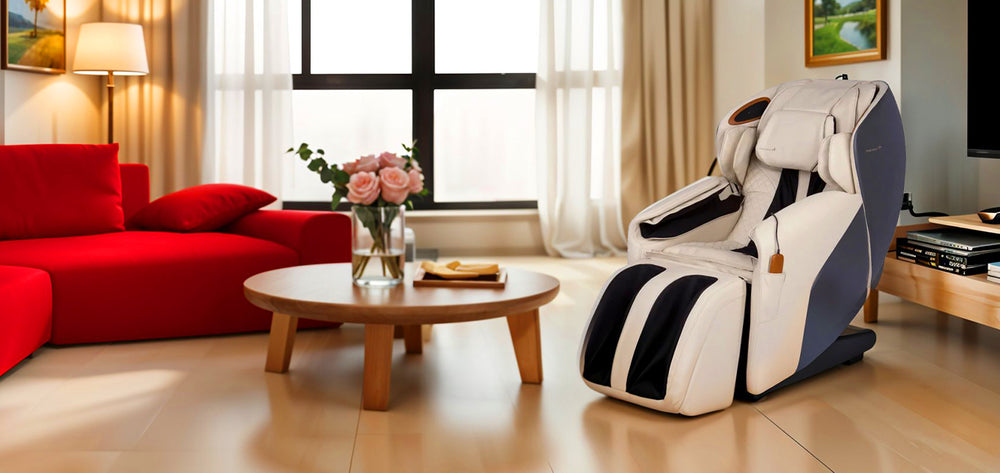 Human Touch Quies Massage Chair in cream placed in a modern living room beside a red sofa and coffee table from Wish Rock Relaxation.