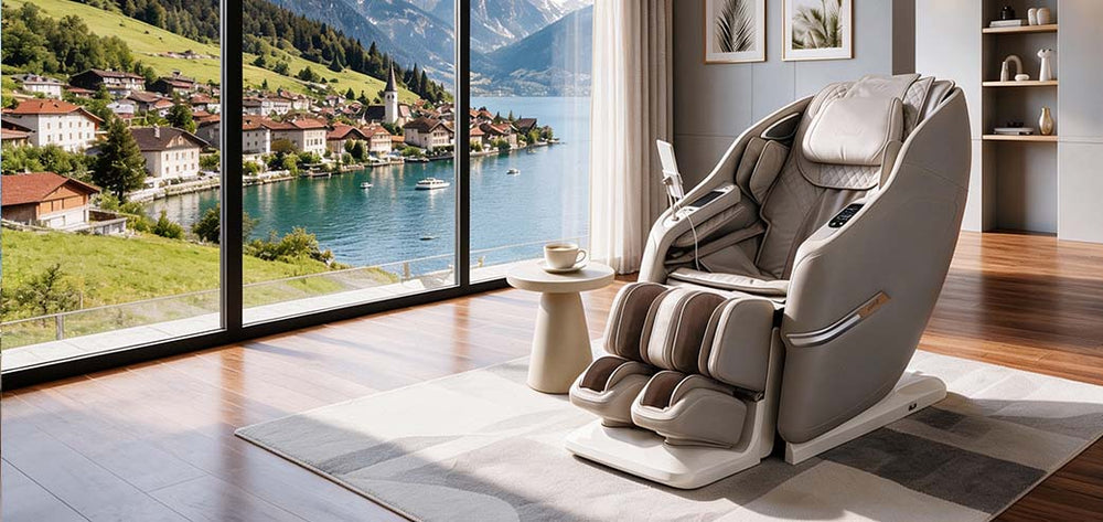 Osaki Aeris 4D Duo massage chair in Taupe upholstery, styled in a modern living room with a lake and mountain view, shown in a square-format lifestyle scene from Wish Rock Relaxation.