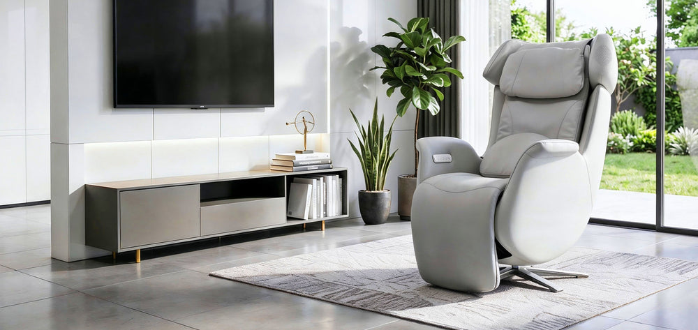 Osaki Milan 3D Recliner Relax Chair in gray leather placed in a modern living room beside a TV console and potted plants from Wish Rock Relaxation