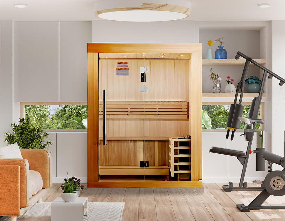 Golden Designs "Sundsvall Edition" 2 Person Traditional Sauna in Canadian red cedar placed in a bright home gym and lounge space from Wish Rock Relaxation