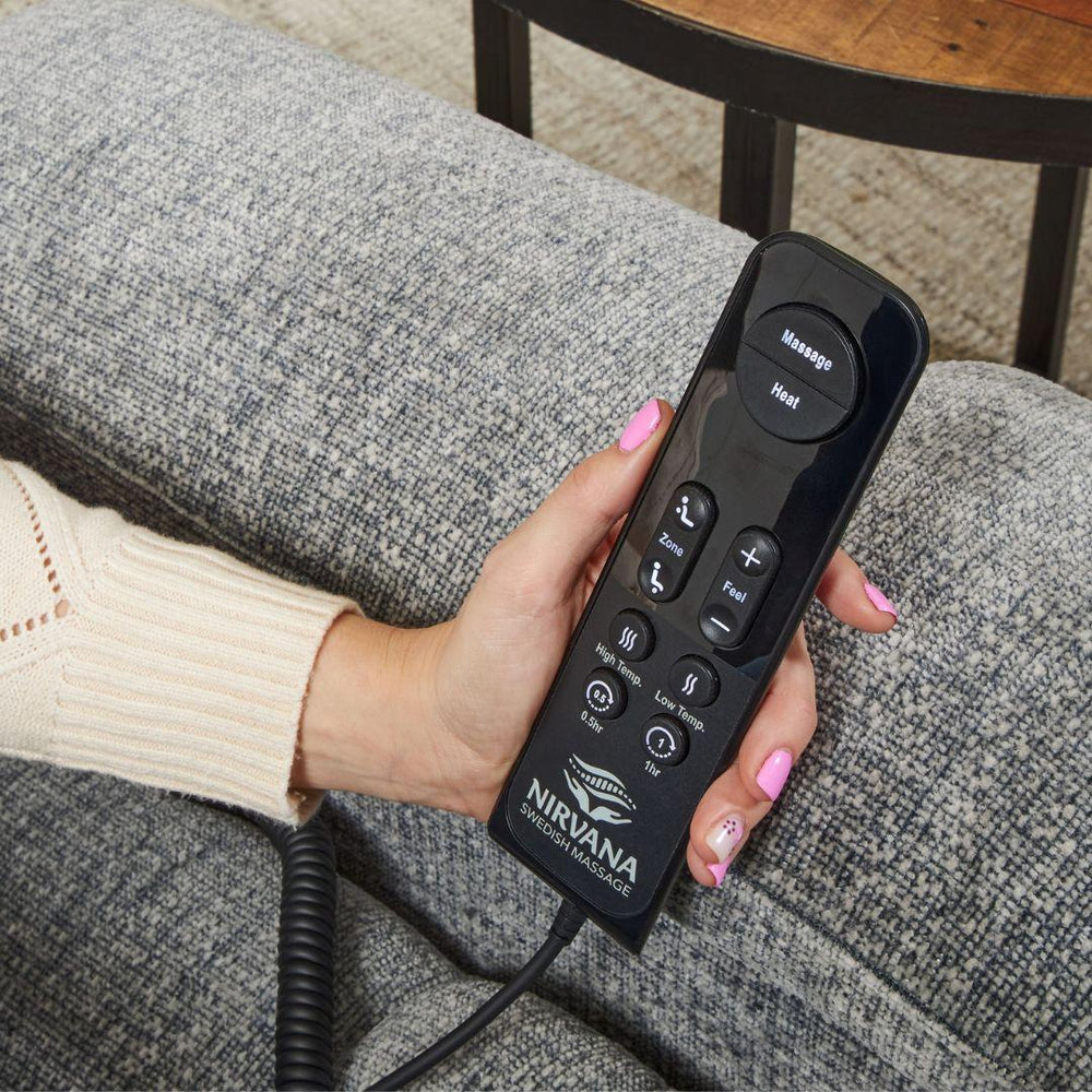 UltraComfort™ UC566 Maya Medium Wide 4-Zone Power Lift Chair shown with Nirvana massage remote in hand.