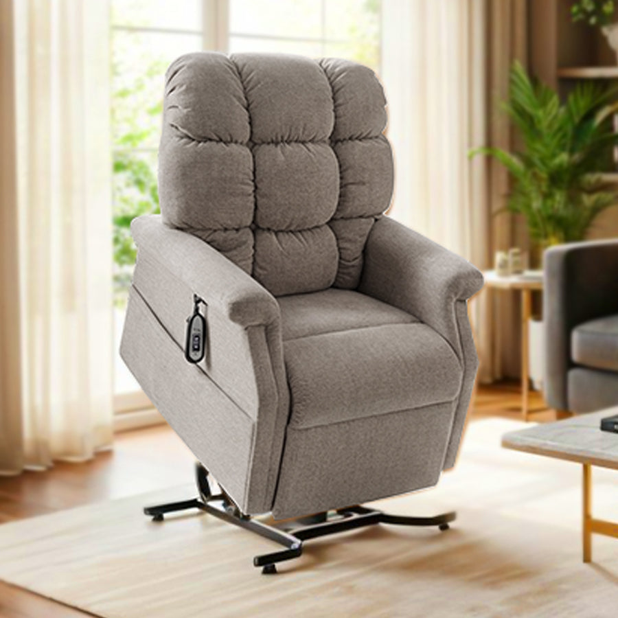 UltraComfort UC480 Aurora Small 1 Zone 3-Position Lift Chair (400lbs) in anchor fabric displayed in a cozy modern living room with gray sofa, gold accents, and natural light from Wish Rock Relaxation