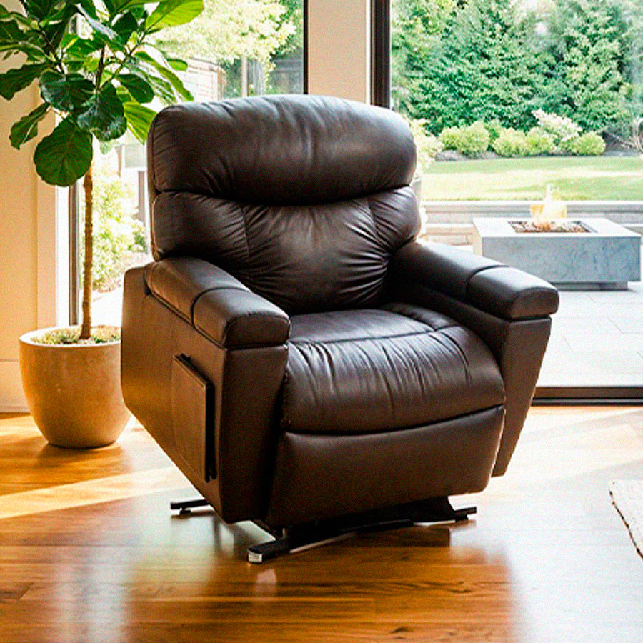 UltraComfort™ UC566 Maya Medium Wide 4-Zone Power Lift Chair in brown shown in a bright living room from Wish Rock Relaxation.
