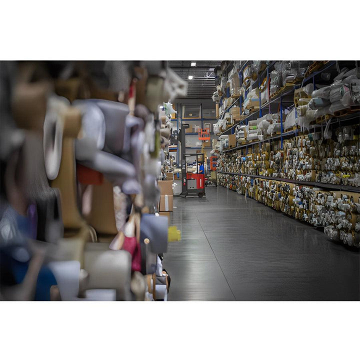 American Leather Nova Comfort Air Zero Gravity Recliner upholstery materials stored in organized warehouse aisle.