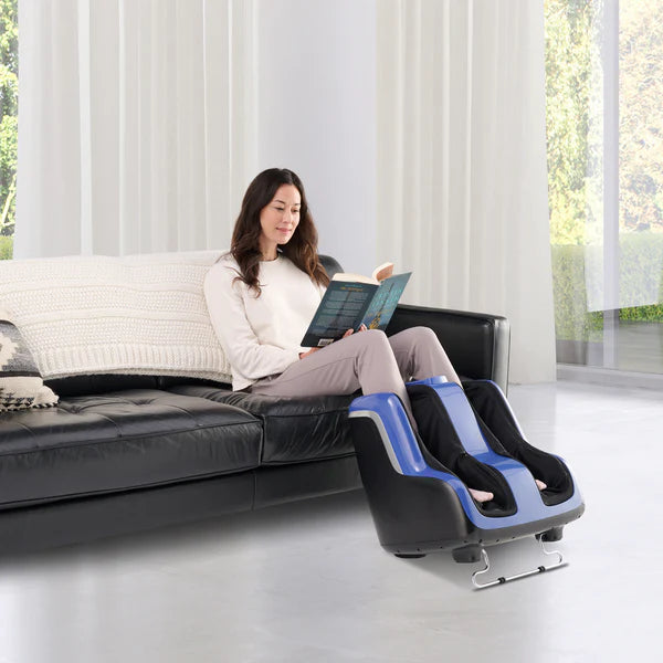 Human Touch Reflex SOL Plus Foot and Calf Massager - blue color shown being used by a relaxed woman reading a book.